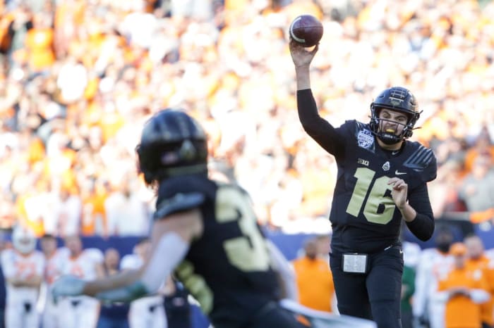 Purdue quarterback Aidan O'Connell throws to wide receiver Jackson Anthrop during the first quarter of the Music City Bowl on Thursday, Dec. 30, 2021, at Nissan Stadium in Nashville.